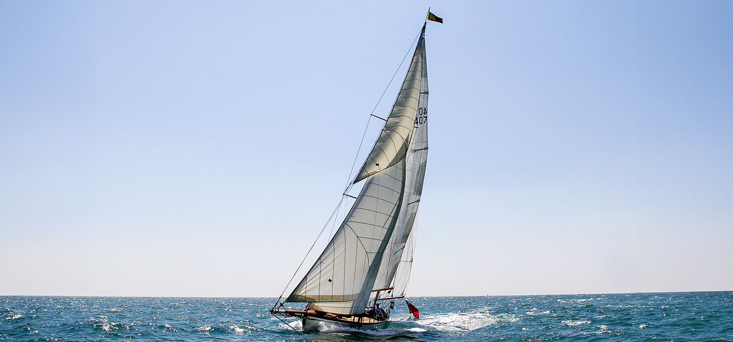 Classic Yacht Classic Yacht, sailing upwind in the sunshine, with Dart sails, designed and made for the boat by Dart Sails and Covers