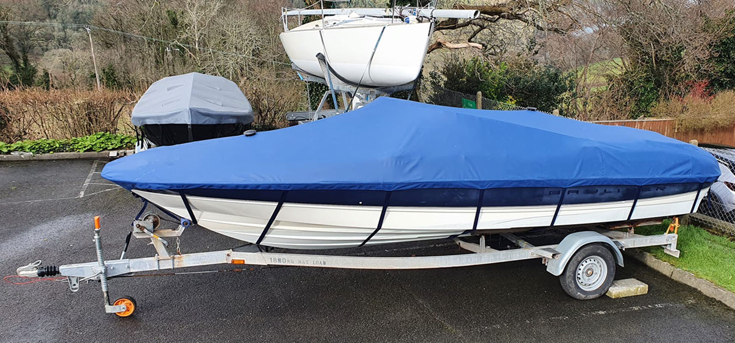 Boat Cover Blue boat cover, made by Dart Sails and Covers, fitted to boat on road trailer