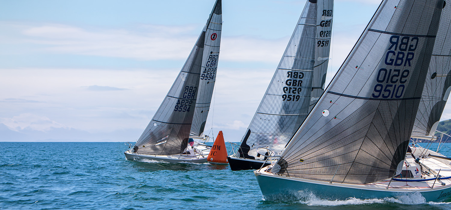 Impalas Impalas racing at Impala Nationals, with first two boats sailing upwind with Dart Sails, designed and made by Dart Sails, in laminate