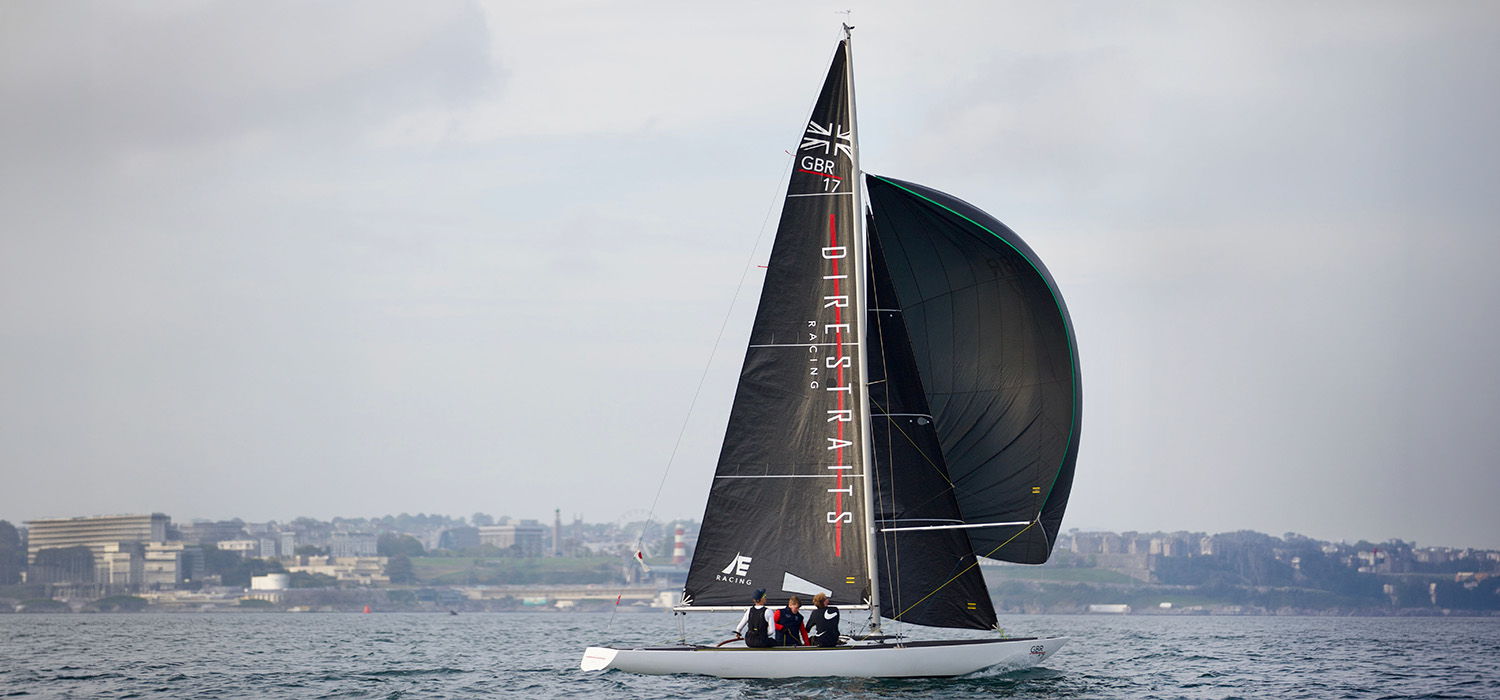 Etchells sailing downwind with Dart sails Etchells sailing downwind with black sails designed and made by Dart Sails, black spinnaker and a black main with logos